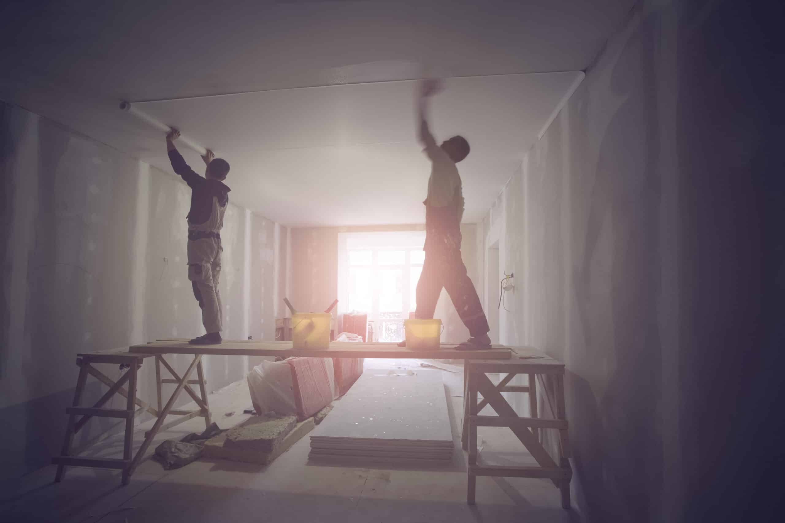 Workers,Are,Installing,Ceiling,From,Wooden,Platform,In,Apartment,Is